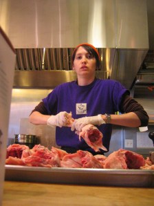 Preparing chickens to go into the oven